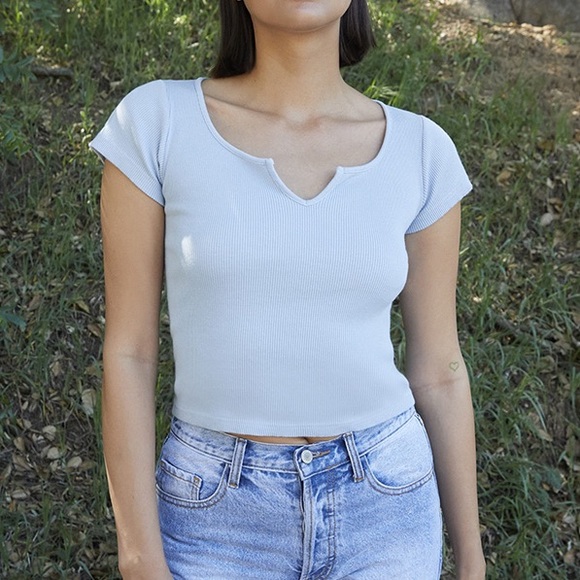 Brandy Melville Tops - NWOT Brandy Melville John Galt Light Blue Richie Notch T-Shirt
